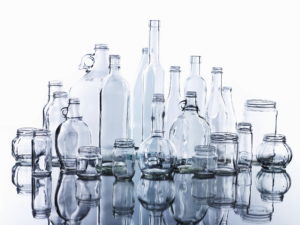 Collection of various glass bottles and jars